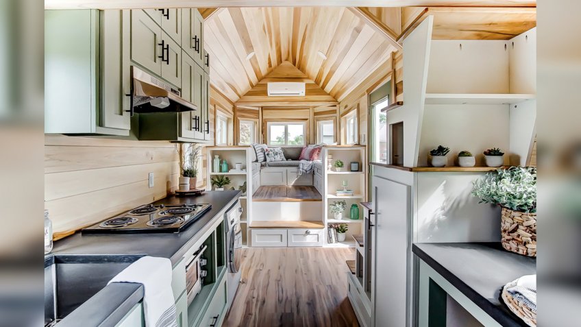 interior of a house from the tiny house movement including open plan kitchen and living room area